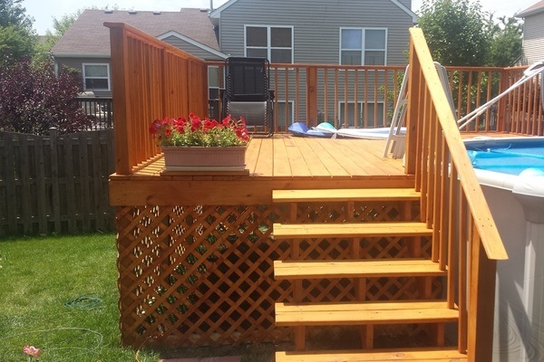 Stairs and deck next to pool